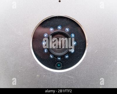The lens of the surveillance camera in a metal case. Stock Photo