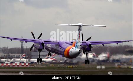 De Havilland Canada Dash 8-400 (G-PRPH) owned and operated by Flybe lands at Heathrow Airport. PA Photo. Picture date: Tuesday February 25, 2020. See PA story . Photo credit should read: Steve Parsons/PA Wire Stock Photo