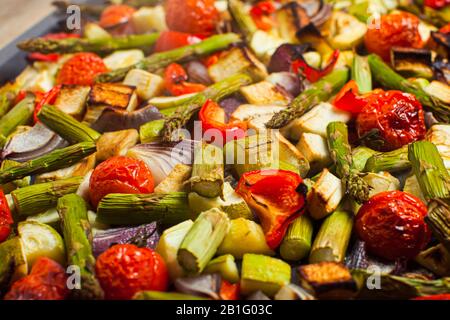 Baked vegetables on a baking tray. Healthy eating concept Stock Photo