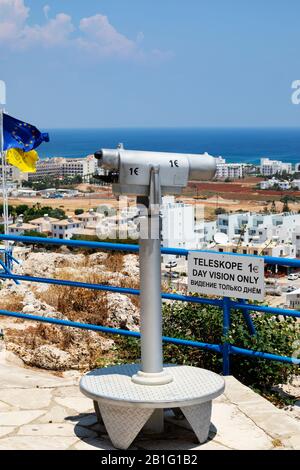 Telescope viewer at The hilltop church of Profitis Ilias, Prophet Elias, overlooking Protarus and Paralimni, Cyprus. Stock Photo