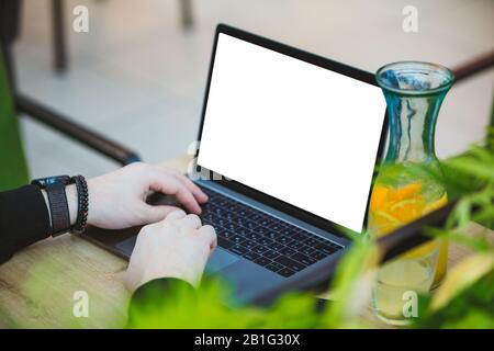 man working on laptop in cafe white screen Stock Photo
