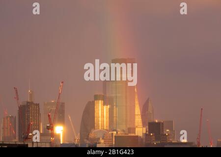 London, UK. 25th Feb, 2020. A double rainbow briefly appeared over the City of London after a rain shower during sunset. Credit: Thamesfleet/Alamy Live News Stock Photo