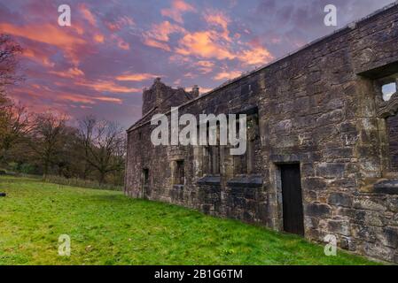 Looking up the tower of The Old Semple Ruins at Castle Semple in Renfrewshire Scotland at a Blazing Red sunset