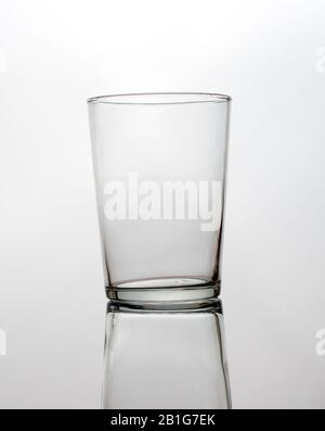 Empty glass with reflection isolated on a white background Stock Photo
