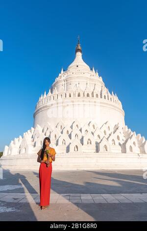 Beautiful young Burmese woman at Hsinbyume Pagoda, Mingun, Mandalay Region, Myanmar Stock Photo