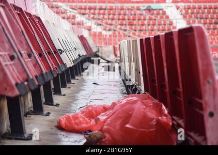 Red and white stadium seats after a match in Girona Stock Photo