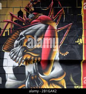 Modern graffiti in Porta Garibaldi distrect of Milan, Italy, depicting a skull and horror figures Stock Photo