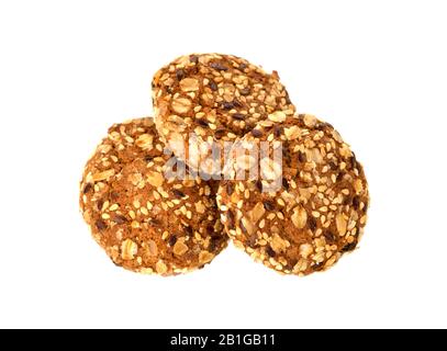 Tasty cookies biscuits on isolated white background. Homemade oatmeal cookies with sesame seeds. Sweet biscuits, pastry. Stock Photo