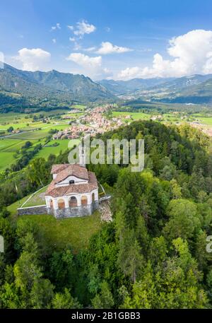 Aerial view of the fields surrounding the small church of Chiesa della Santissima Trinità in Clusone city. Stock Photo