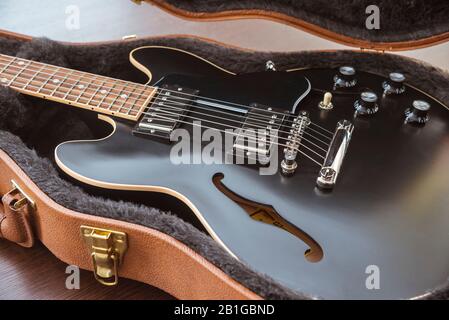 Gibson ES 339 Style Semi-Hollow Body Electric Guitar Close-up in case on a wooden background Stock Photo