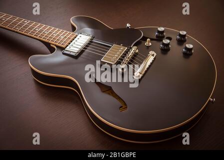 Gibson ES 339 Style Semi-Hollow Body Electric Guitar Close-up on a wooden background Stock Photo