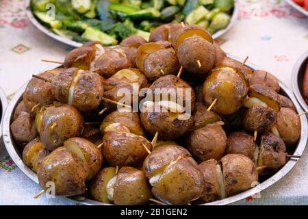 Potatoes with lard on skewers. Ukrainian national food. Stock Photo