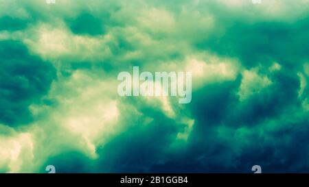 Dramatic stormy dark green cloudy sky, natural photo background. Stock Photo