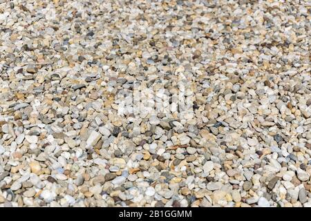 Rolled gravel in a driveway on a sunny day Stock Photo