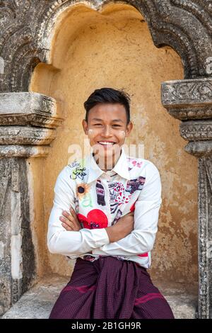 Young Burmese man posing at Shwegugyi Temple, Bagan, Mandalay Region, Myanmar Stock Photo