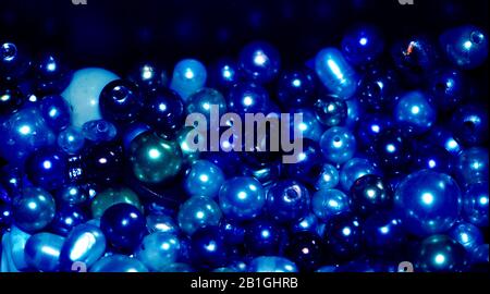 Blue pearls and beads background made of different kinds of beads Stock Photo