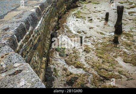 Watchet, Somerset, The low tide blocks the fishermen's ships in the port of Watchet, exposing the shallow muddy bottom summer 2019 Stock Photo