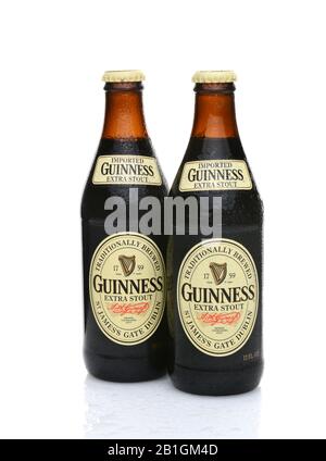IRVINE, CA - MAY 25, 2014: Two bottles of Guinness Extra Stout with condensation. The Irish beer is one of the worlds most successful beer brands with Stock Photo
