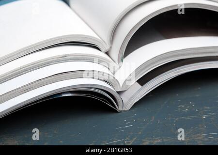 Close up stacking magazine place on table background. Creative photo. Stock Photo