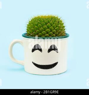Cactus grown recycled tin mug with happy face, fun quirky eco reuse, upcycle zero waste concept