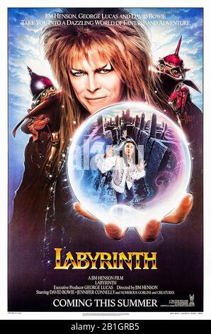 Labyrinth (1986) directed by Jim Henson and starring David Bowie, Jennifer Connelly and Toby Froud . Sarah has 13 hours to save her baby brother from the Goblin King in his castle in the middle of a maze. Stock Photo