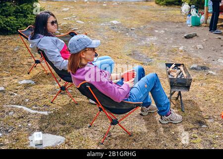 Bishkek, Kyrgyzstan - April 9, 2019: International mointain day. People rest after a hike. Stock Photo