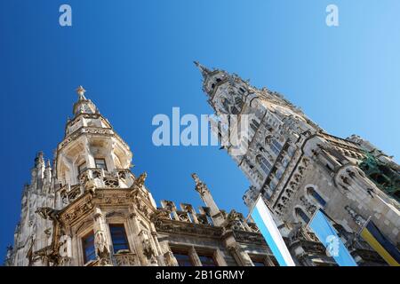 Bottom view of Munich new townhall located on Marienplatz under a clear blue sky. This famous square is one of the main travel destination of the city Stock Photo