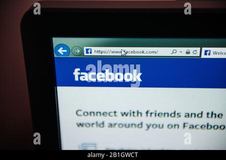 London, United Kingdom - Feb 28, 2014: Macro of Facebook social network website address on computer display screen with message connect with your friends - tilt-shift lens used Stock Photo