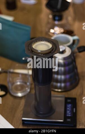 Aeropress, steel scales, coffee. Stylish accessories and items for alternative coffee Stock Photo