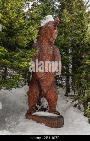 Vancouver, British Columbia, Canada - December, 2019 -Massive Wooden sculpture of a Grizzly Bear at Grouse Mountain, the peak of Vancouver. Stock Photo