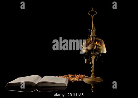 Antique Lamp Moroccan Oil Lamp With Seeds And Book Stock Photo Alamy