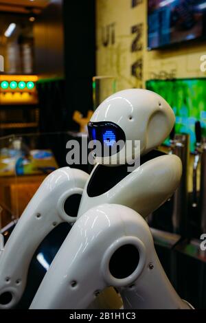 Robot with mechanical arms close up view. Stock Photo
