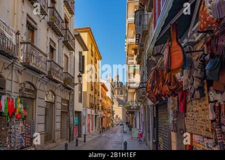 Granada, Spain - January 6, 2020: View of the building of the Basilica of Saints Justus and Pastor with street view, Andalusia
