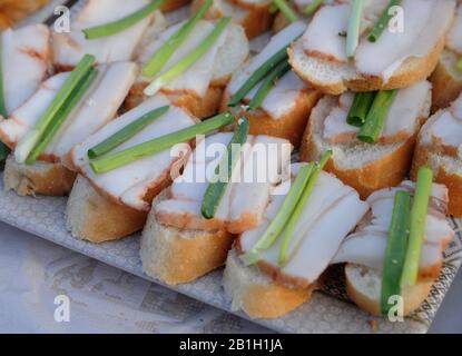 Kiev, Ukraine. 22nd Feb, 2020. Sandwiches with bacon during the event.The ''Weekend Sala'' on the territory of the National Complex ''Expocenter of Ukraine'' (VDNH) in Kiev, fat, the most beloved Ukrainian product is sold. The event also involves degustation by guests, competition and a holy concert. Credit: Alexey Ivanov/SOPA Images/ZUMA Wire/Alamy Live News Stock Photo