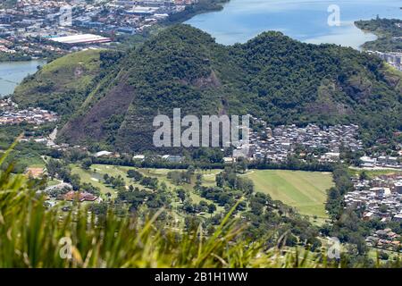 Golf club in the Barra da Tijuca neighbourhood in Rio de Janeiro with city lake behind seen from the Pedra Bonita rock in the Tijuca forest Stock Photo