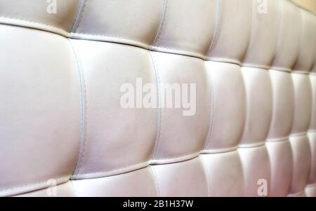 Tufted white leather headboard texture, used for background Stock Photo