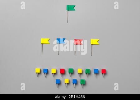 Colorful push pins isolate on gray background Stock Photo