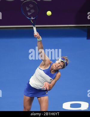 Doha, Qatar. 25th Feb, 2020. Laura Siegemund of Germany serves during the women's singles second round match against Ashleigh Barty of Australia at the 2020 WTA Qatar Open in Doha, Qatar, Feb. 25, 2020. Credit: Nikku/Xinhua/Alamy Live News Stock Photo