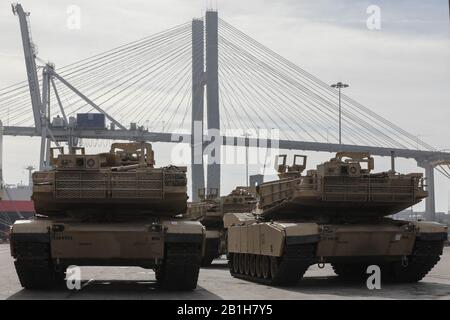 Soldiers assigned to 2nd Brigade Combat Team wait to move M1A1 Abrams tanks aboard a military transport vessel in support of DEFENDER-Europe 20 at the Port of Savannah, Ga. February 12, 2020.      DEFENDER-Europe 20 is the deployment of a division-size combat-credible force from the United States to Europe, the drawing of equipment and the movement of personnel and equipment across the theater to various training areas. U.S.-based equipment will leave from ports in four states and arrive in six European countries. This will require the support of tens of thousands of service members and civili Stock Photo