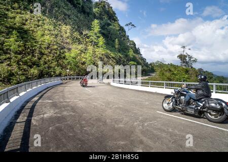 Ho Chi Minh Road, Thua Thien Hue Province, Vietnam - February 8, 2020: Tourists on motorbikes. This section of Ho Chi Minh road passes through the pri Stock Photo