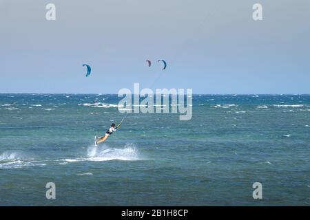 Ninh Chu Beach, Ninh Thuan Province, Vietnam - January 9, 2020: Kite surfing scene on the beach in Ninh Chu. Kite surfing is a sport that is loved by Stock Photo