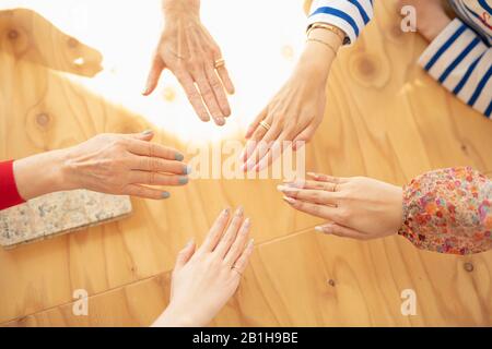 Hands putting together Stock Photo