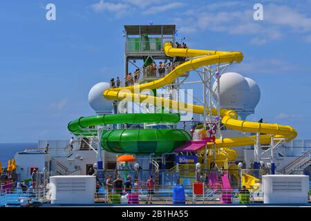 Carnival Splendor, South Pacific Ocean - February 13, 2020: Water slides and splash zone on cruise ship. Stock Photo