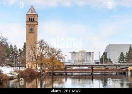 The Great Northern Clocktower and bridge along the Spokane River at winter in downtown Riverfront Park in Spokane, Washington, USA Stock Photo