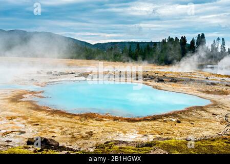 Geothermal hot spring with steam rising up off water. Stock Photo