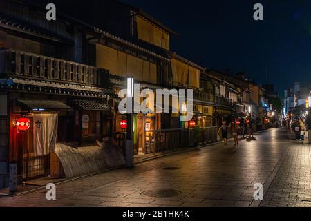 Night view of wooden machiya merchant house lined along a street in Gion, Kyoto's most famous geisha district Stock Photo