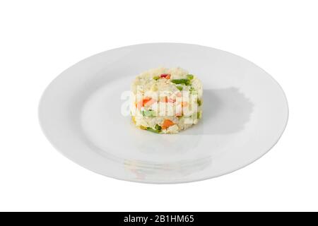 Long grain rice with vegetables, cooked portion of side dish on a plate on a white isolated background, Side view. Appetizing dish for the menu restau Stock Photo