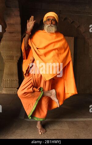 19th Mar 2019, Pune , Maharashtra, India. Indian sadhu or monk standing on one leg in blessing pose Stock Photo