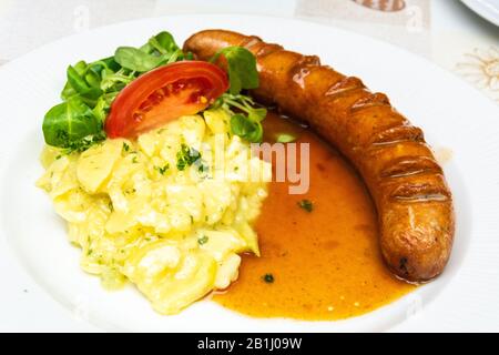 German Bratwurst sausage with potato salad in Fussen, Germany. Stock Photo