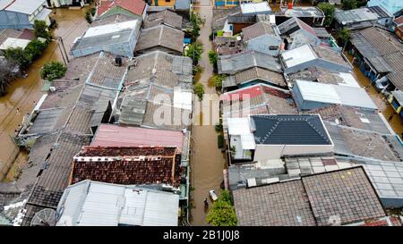 Aerial POV view Depiction of flooding. devastation wrought after massive natural disasters at Bekasi - Indonesia Stock Photo